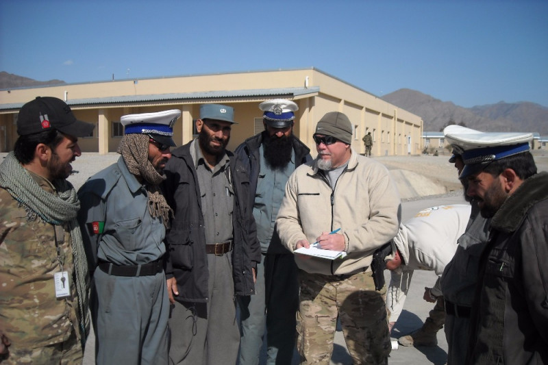 Afghans being instructed about traffic control.