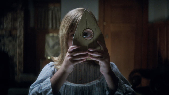 Doris, (Lulu Wilson), is about to witness something very frightful when looking the Ouija eyeglass.   
 
