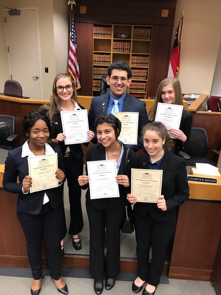 Students posing with their Outstanding Attorney and Outstanding Witness awards.
Top row, left to right: Cheney Dunwoodie, Ayush Kumar, Bella Fortenberry.
Bottom row, left to right: Shanel Pouatcha, Ruhi Shirke, Shir Halfon.