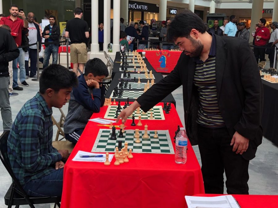 Panda playing against chess champion Hikaru Nakamura in a simultaneous exhibition.