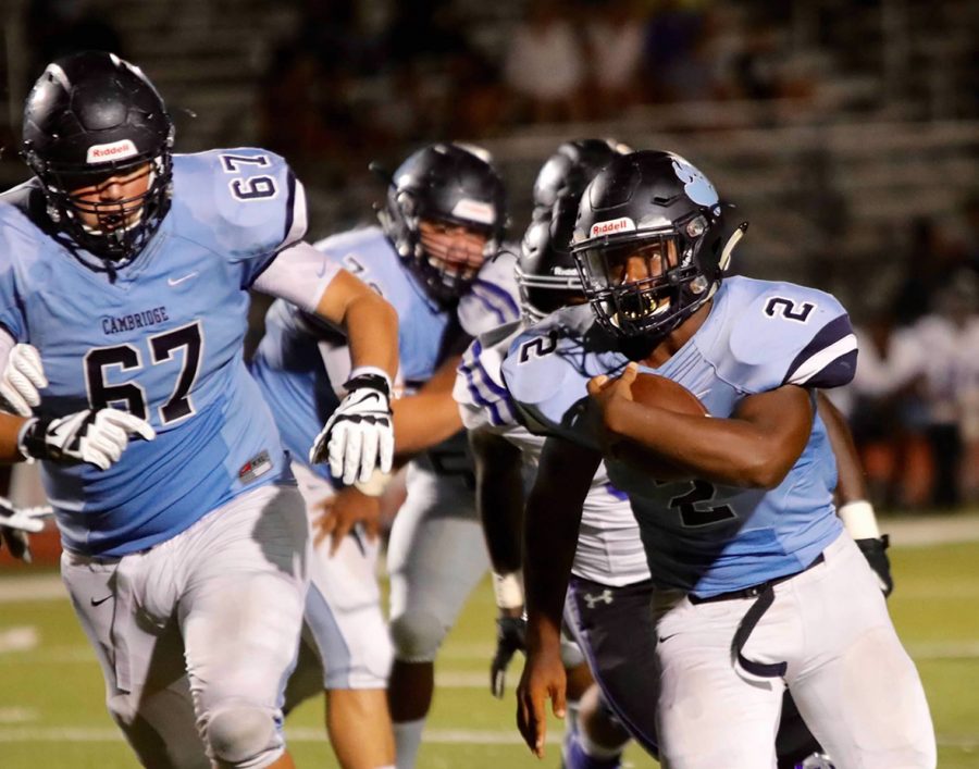 Junior Phillip Michael Collins running the ball in a game against Centennial High School.