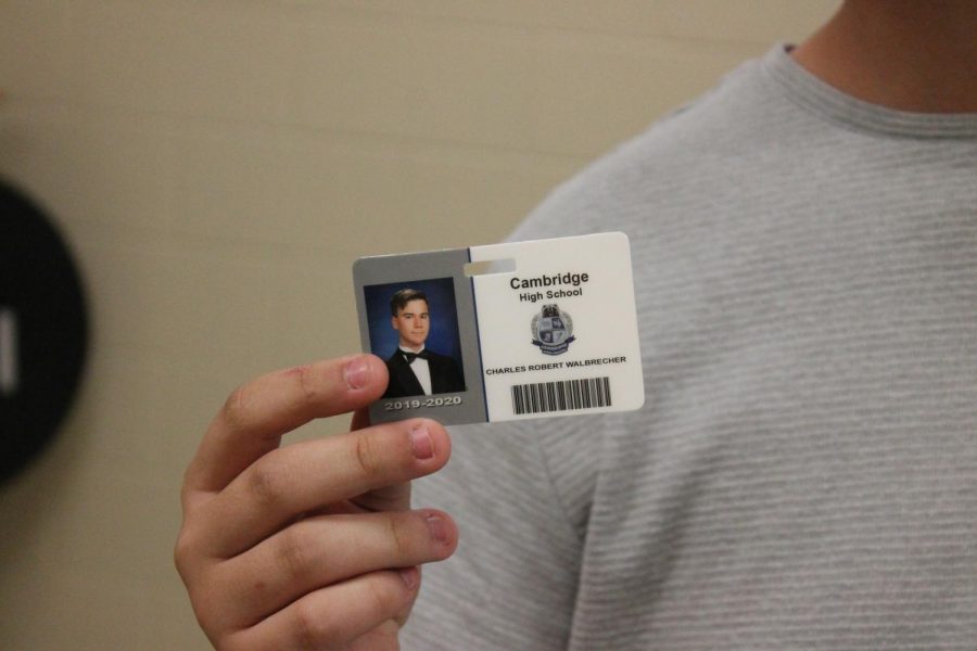 Senior+Charles+Walbrecher+flashes+his+newly+minted+student+ID+card.