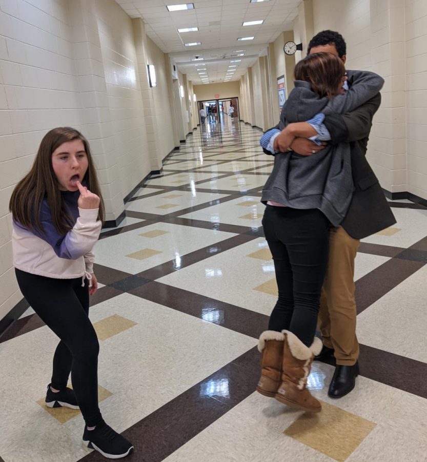 Rachel Lichtenwalner gagging at the sight of couple Katherine Ferrero and Blaise Williams posing in an example of annoying PDA.