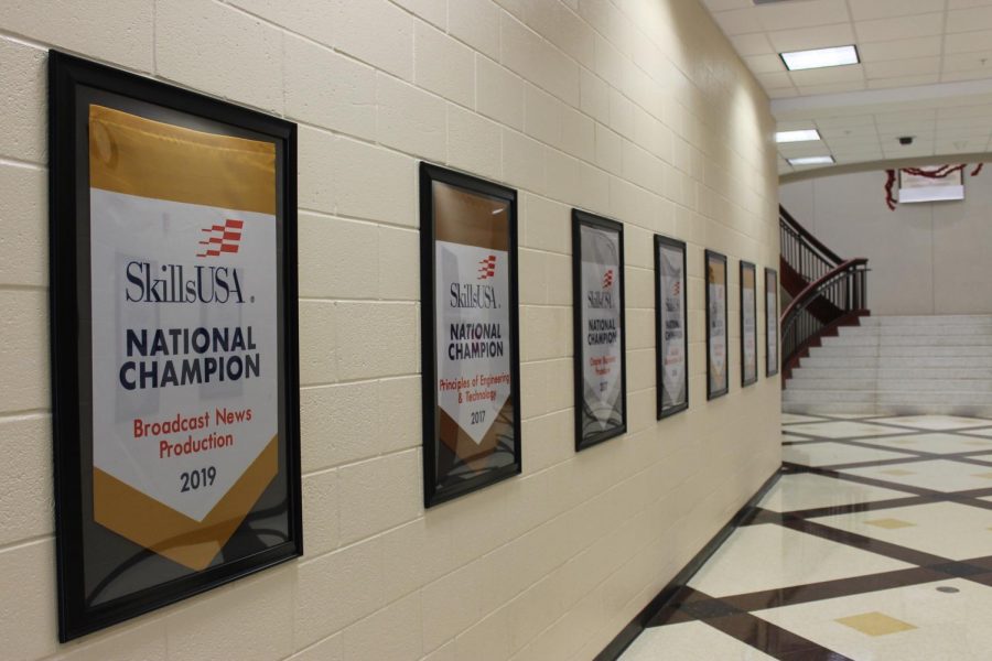 Banners emblazoned with National Champion for various competitions, such as Broadcast News Production and Architectural Drafting, line the halls.