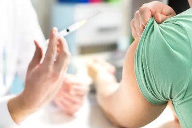 A doctor administering a flu shot to a patient.