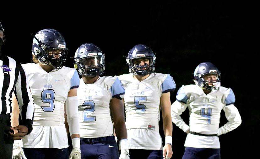 The captains wait to go on the field against Buford High School, the last game of the season. Left to right: senior Luke Ritter, senior Phillip Michael Collins, senior Luke Kramer, and senior Hayden Gardella.