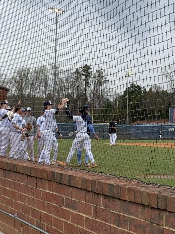 After Senior Jayden Carbonell-Smith hit a home run, the team ran out of the dugout to congratulate him.