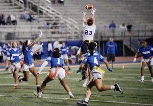 Senior Sarah Meredith leaps to catch the ball.
