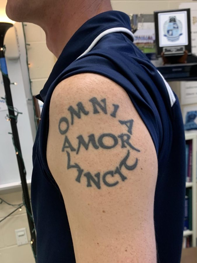 On his left shoulder, Latin teacher Jeffery Davis has a tattoo that reads “Love conquers all things.” It’s a quotation from the Roman poet Virgil. 
