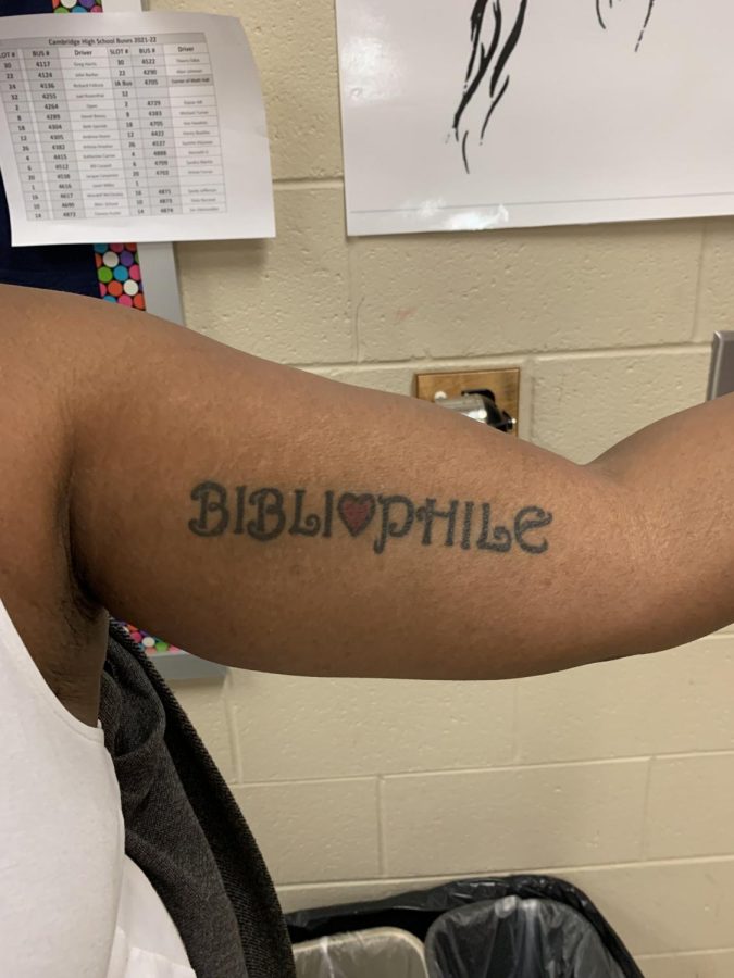 On her left bicep, English teacher April Smith has a tattoo that says “Bibliophile,” which means “lover of books.” 