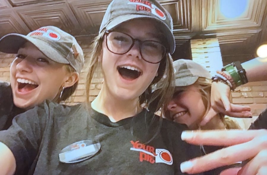 From left to right: Natalie Amstutz, Meadow Riggins, Kaitlyn Clark pose at Your Pie, their workplace.