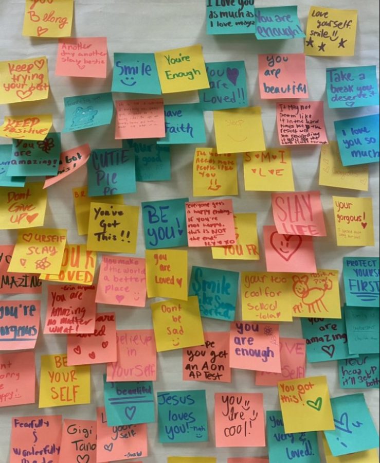 An+encouragement+wall+filled+with+positive+notes+from+students+in+honor+of+suicide+prevention+month.+
