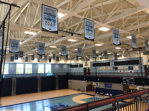 The many banners that hang above the schools main gymnasium reflect its successes in both 5A and 6A.