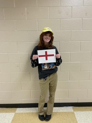 Megan holding the English flag, the country she believes will win the World Cup.