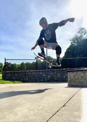 Batterman at the skate park doing his tricks. 