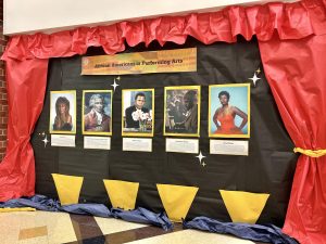 The performing arts mural. It is located outside of the theater black box in the performing arts hallway.